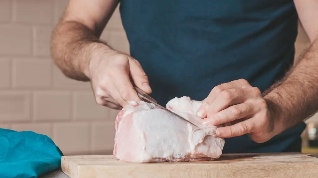 trimming fat from meat