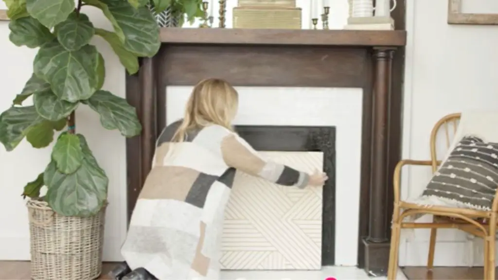  cover the brick fireplace opening with painted plywood to hide it