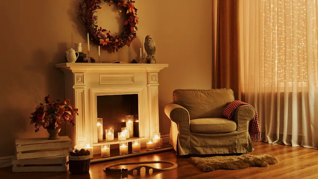 display candles before fireplace to hide it