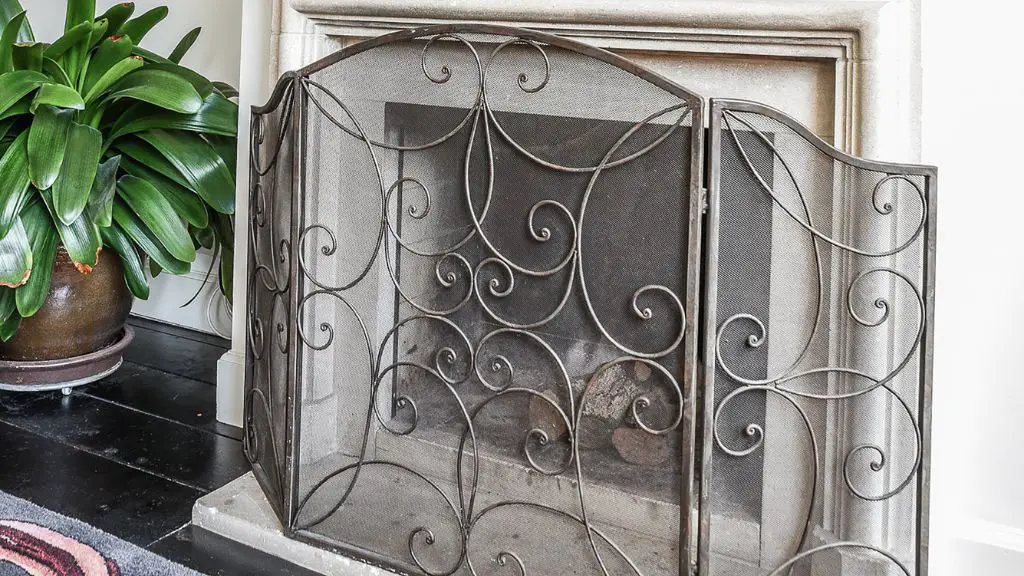 insert  an ornamental screen or photograph to hide it