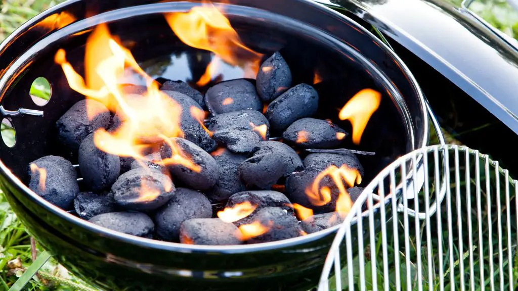 adding charcoal to smoker