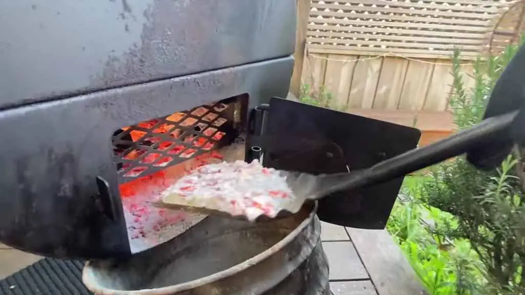 cleaning the ash with a shovel